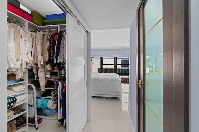 walk in closet featuring light tile patterned floors