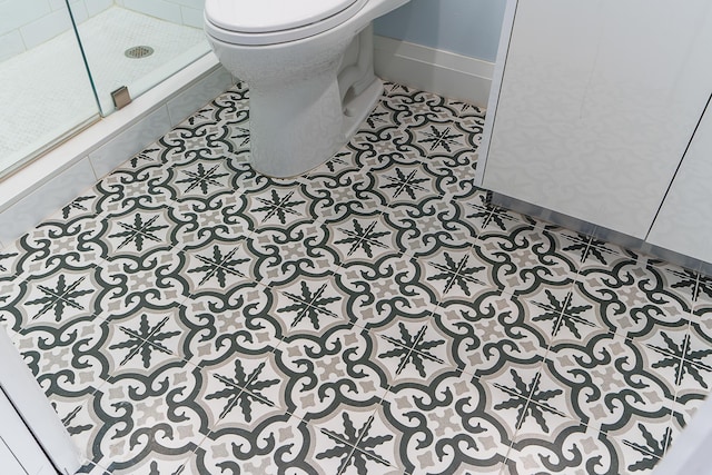 room details with a tile shower and toilet