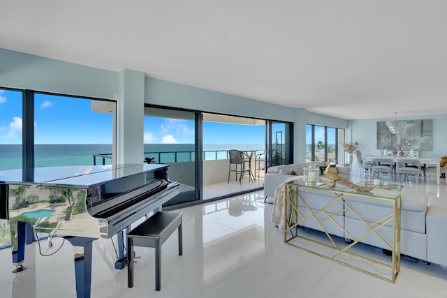 tiled living room featuring a water view