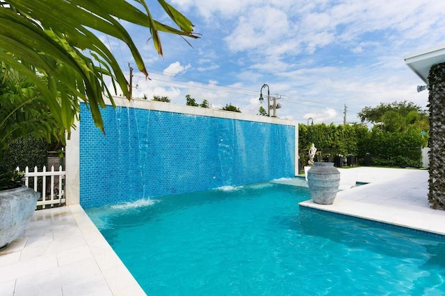 view of pool featuring a patio area and pool water feature