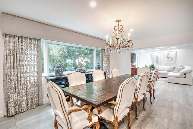 dining space with an inviting chandelier