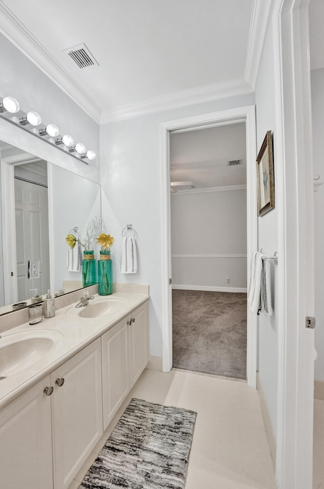 bathroom with vanity and crown molding