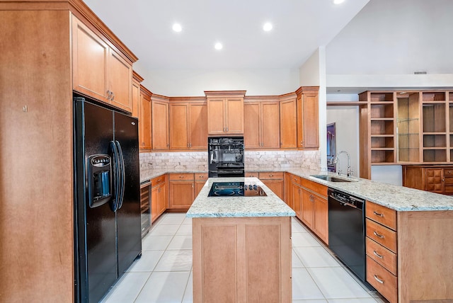 kitchen with kitchen peninsula, black appliances, sink, and light tile patterned floors