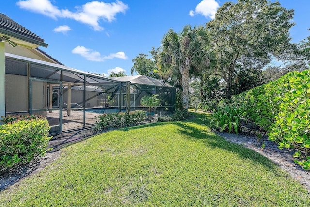 view of yard with a lanai