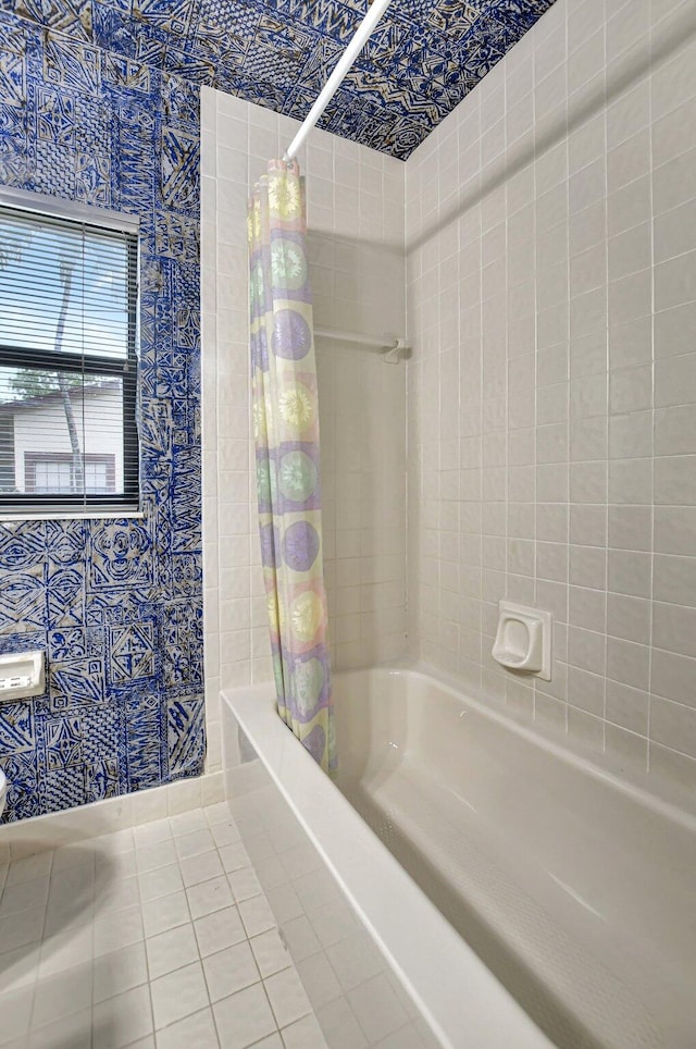 bathroom featuring tile patterned flooring and shower / bath combo