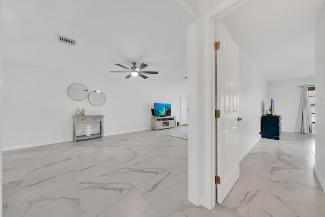 living room with ceiling fan and vaulted ceiling