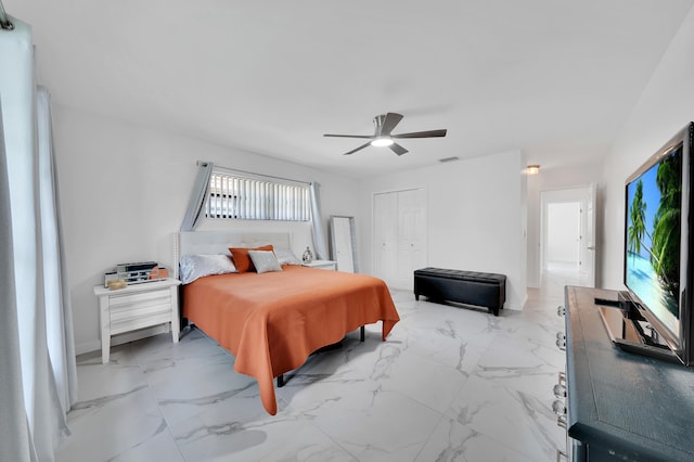 bedroom featuring a closet, multiple windows, and ceiling fan