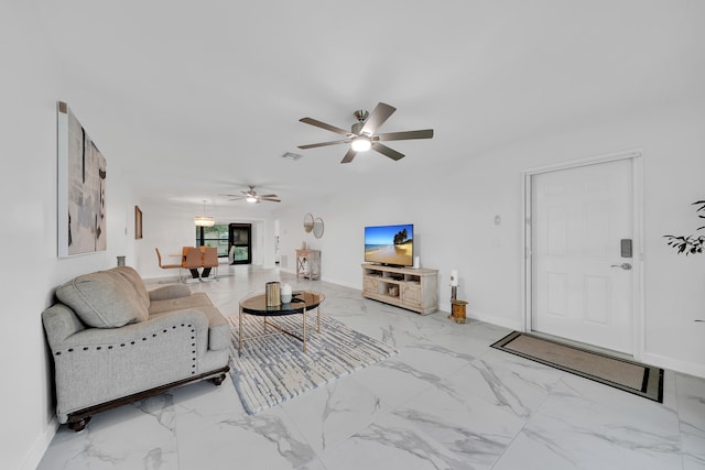 living room featuring ceiling fan