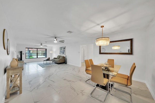 dining room featuring ceiling fan with notable chandelier