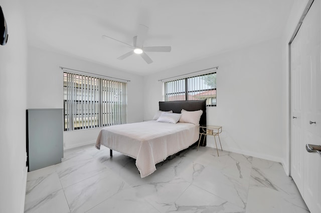 bedroom featuring a closet and ceiling fan