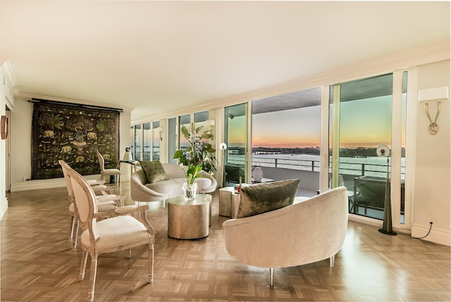 living room featuring light parquet flooring and floor to ceiling windows