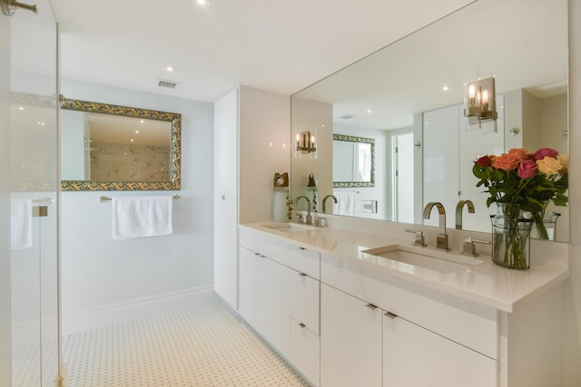 bathroom featuring a shower and vanity