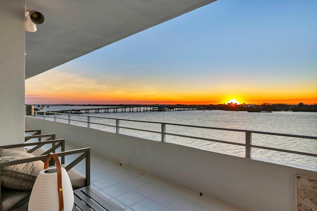 balcony at dusk with a water view