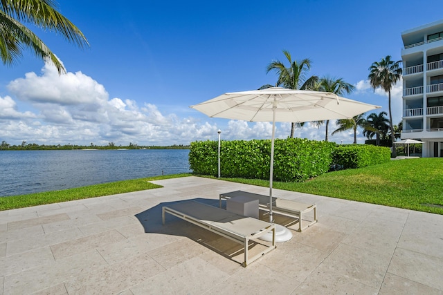 view of patio with a water view