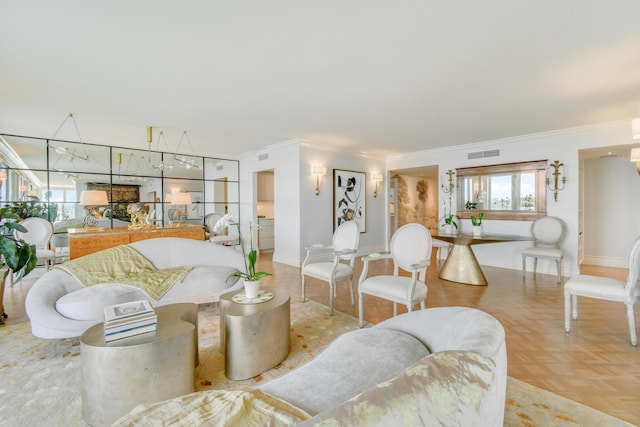 living room with ornamental molding, a notable chandelier, washer / clothes dryer, and light parquet flooring