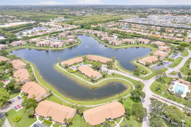 view of property location featuring nearby suburban area and a large body of water