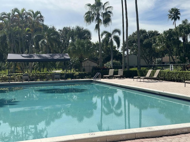 community pool featuring fence