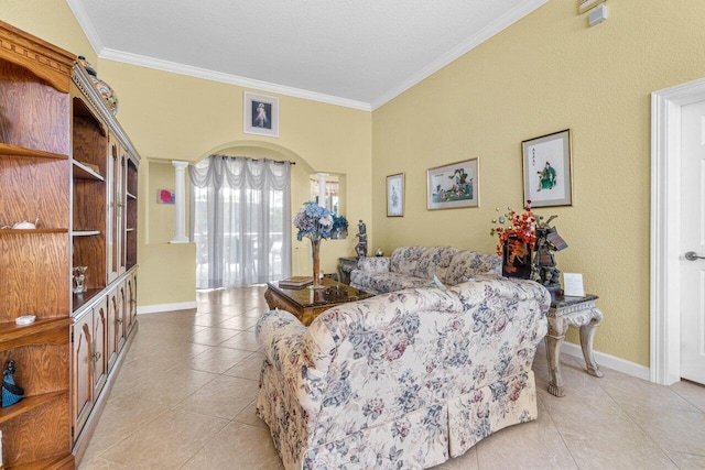 tiled living room featuring a textured ceiling, crown molding, and ornate columns