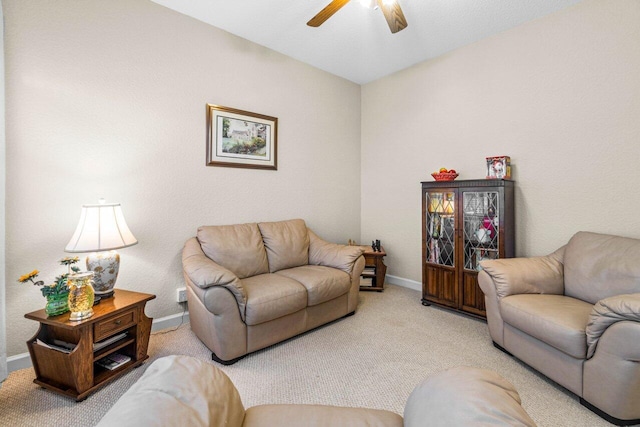 living room with ceiling fan, light carpet, and vaulted ceiling