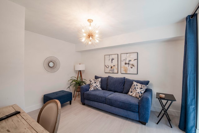 living room featuring an inviting chandelier and hardwood / wood-style flooring