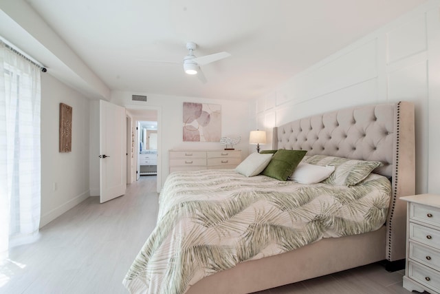 bedroom with ceiling fan and light hardwood / wood-style flooring