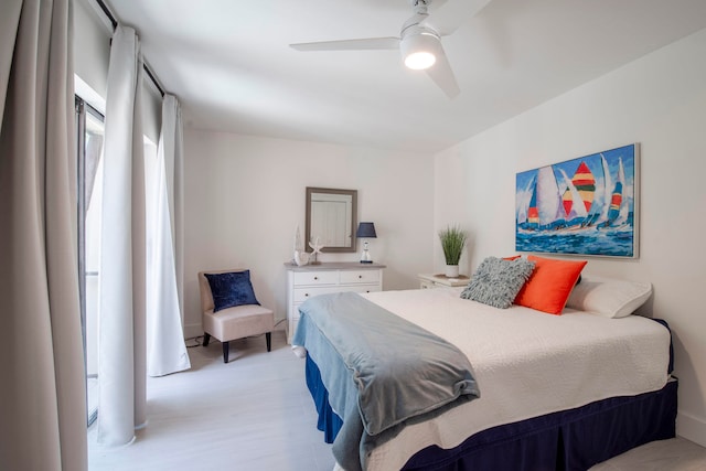 bedroom featuring light wood-type flooring and ceiling fan