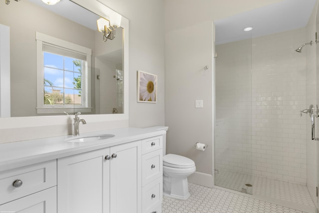 bathroom with vanity, tile patterned flooring, toilet, and an enclosed shower