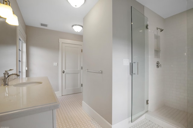 bathroom featuring vanity and walk in shower