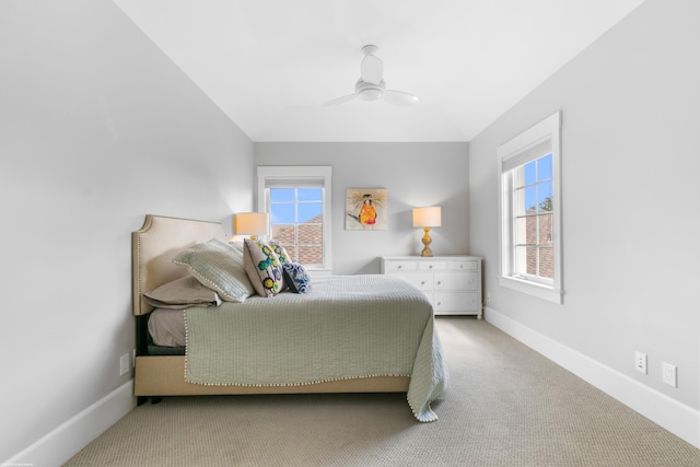 carpeted bedroom with lofted ceiling and ceiling fan