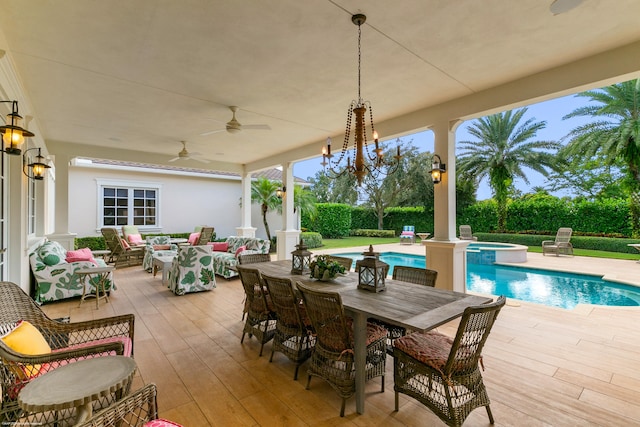 view of patio with a fenced in pool, outdoor lounge area, and ceiling fan