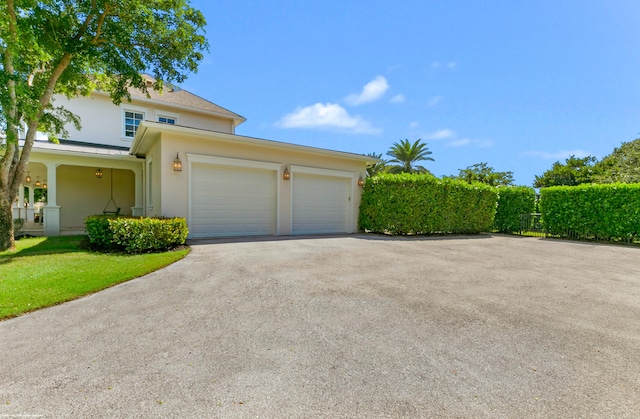 view of property exterior with a garage