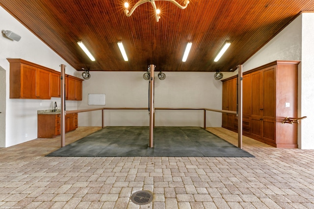 garage featuring sink and wood ceiling