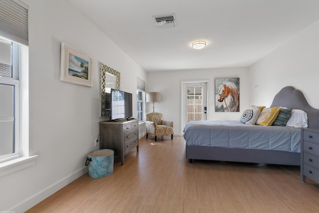 bedroom with light hardwood / wood-style floors