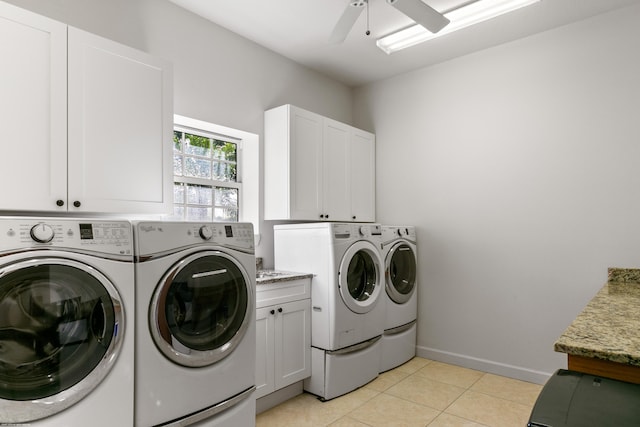 washroom featuring cabinets, independent washer and dryer, light tile patterned flooring, and ceiling fan