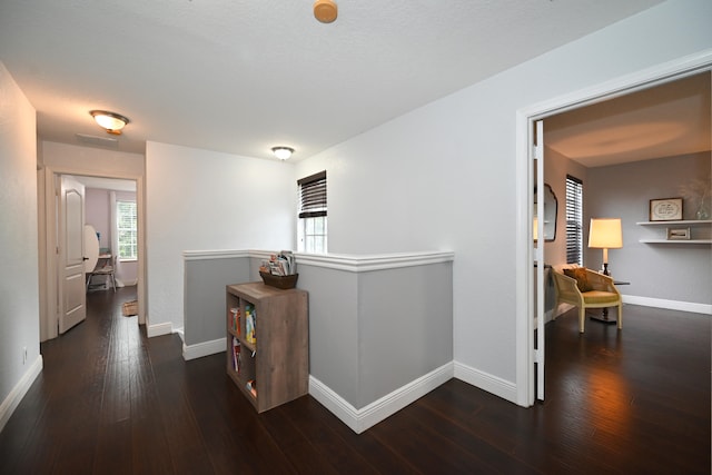 hall with dark hardwood / wood-style floors