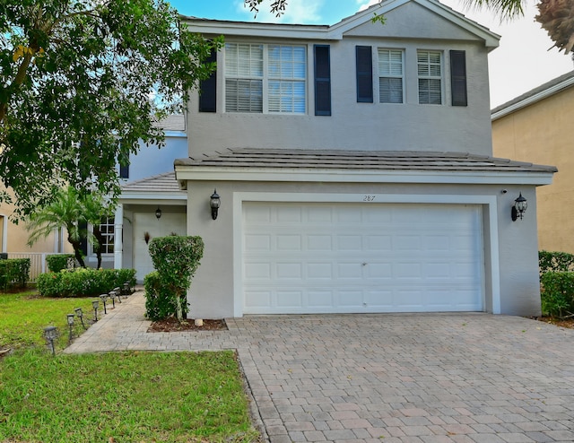 front of property with a garage