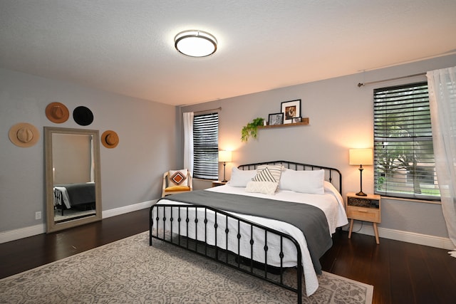 bedroom featuring dark hardwood / wood-style floors