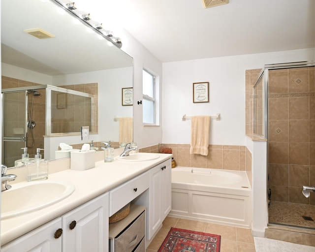 bathroom featuring tile patterned flooring, vanity, and independent shower and bath