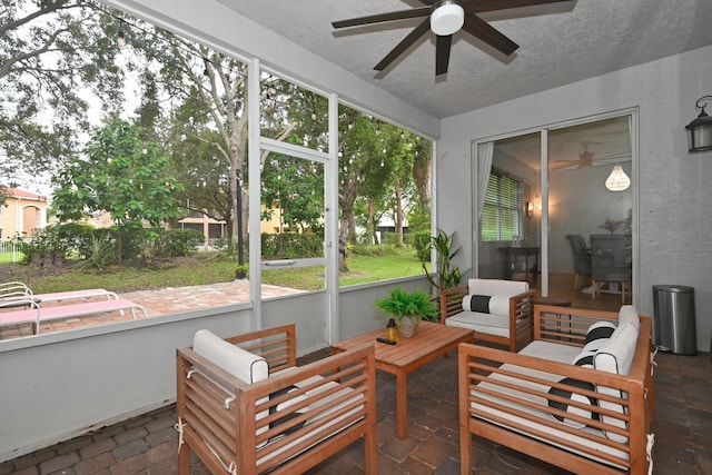 sunroom / solarium with ceiling fan