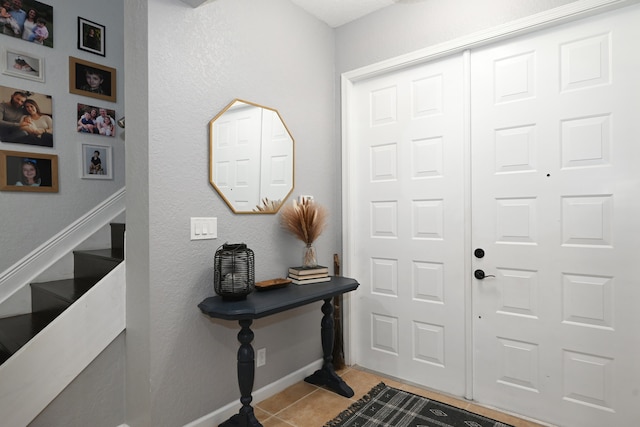 foyer featuring light tile patterned floors