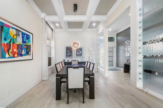 dining room featuring light wood-type flooring, coffered ceiling, beam ceiling, and ornamental molding