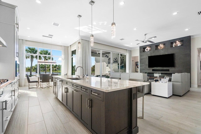 kitchen featuring ceiling fan, sink, pendant lighting, and white cabinets