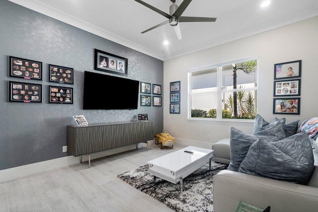 living room with ceiling fan and crown molding