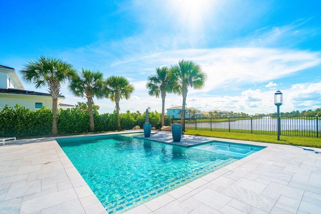 view of pool featuring a patio and a water view