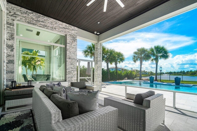 view of patio featuring an outdoor hangout area, a fenced in pool, and ceiling fan