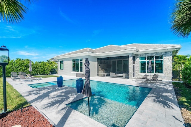 view of swimming pool featuring a patio area