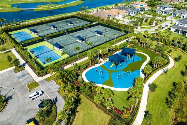 birds eye view of property with a water view