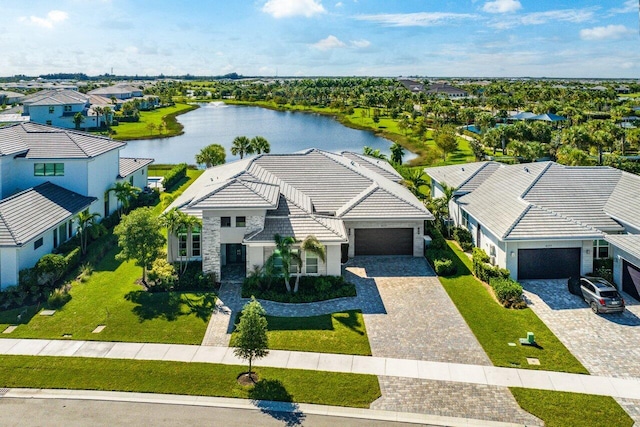 birds eye view of property with a water view