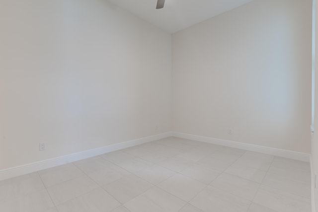 unfurnished room with light tile patterned flooring and ceiling fan