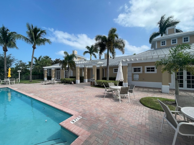 view of swimming pool featuring a patio area